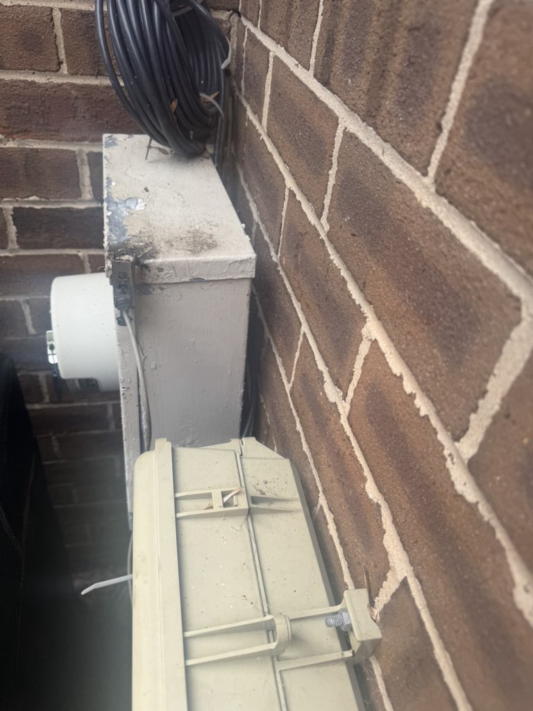 Electrical disconnect equipment mounted on brick