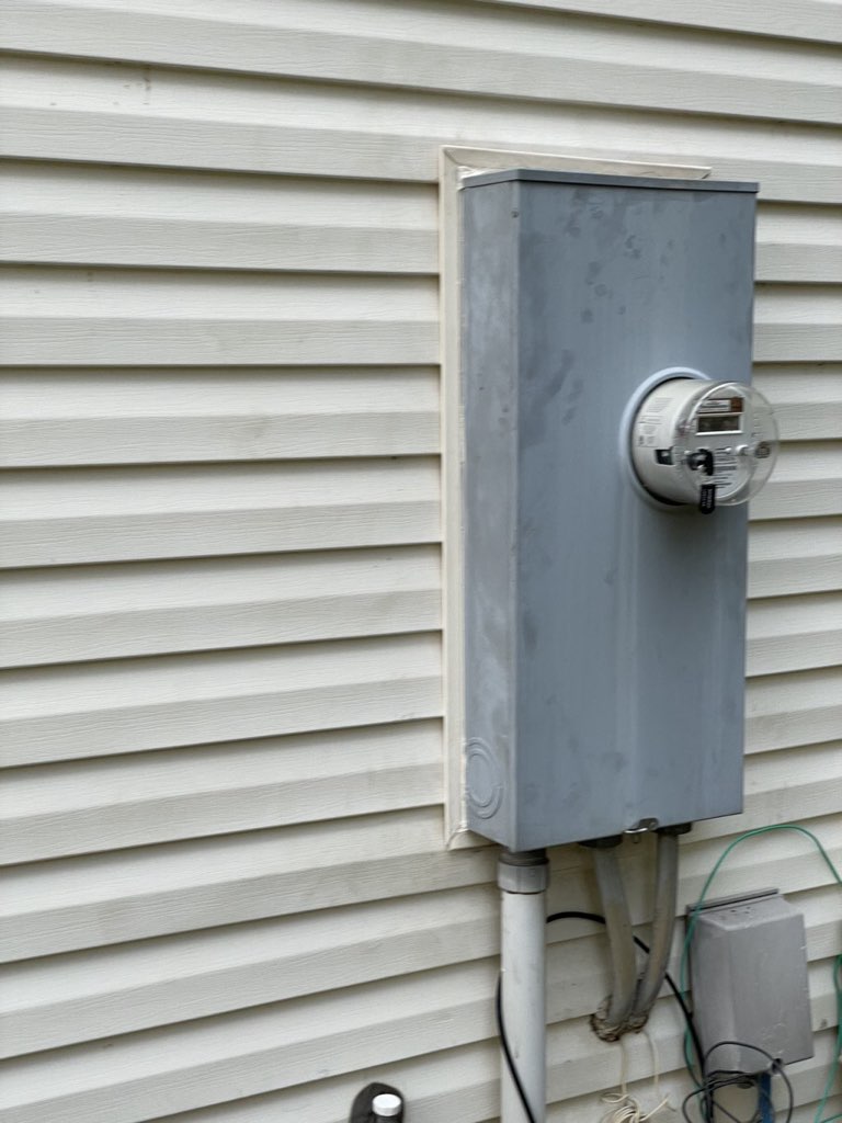 Electric meter properly reset and secured to a house