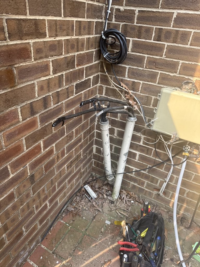 Underground electrical service risers exposed for repair